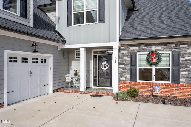 view of exterior entry featuring a garage