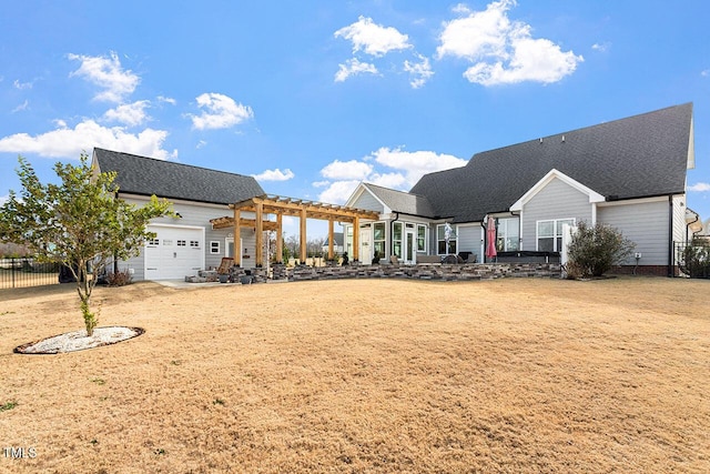 view of front of home with a garage and a pergola