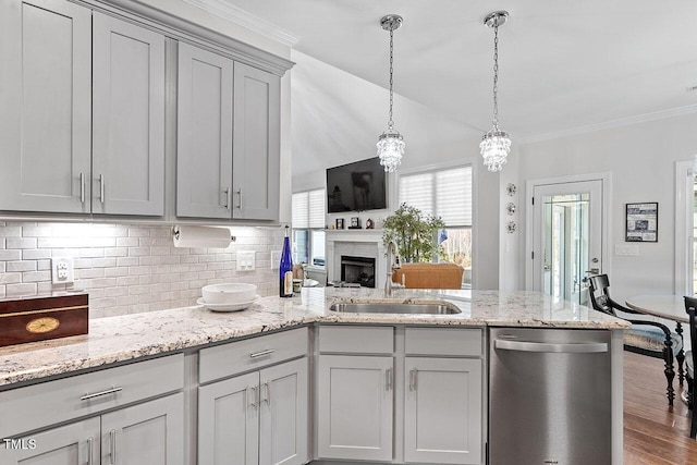 kitchen with backsplash, sink, decorative light fixtures, dishwasher, and gray cabinets