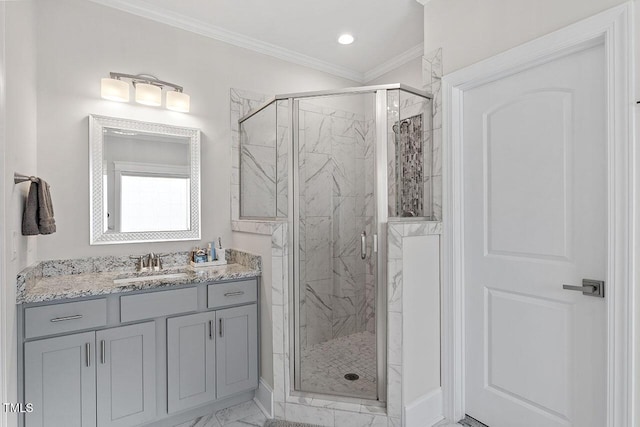 bathroom featuring crown molding, vanity, and a shower with shower door