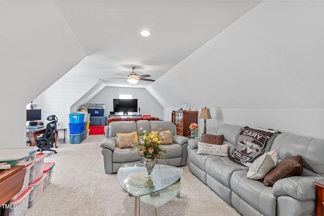 living room with carpet flooring, ceiling fan, and lofted ceiling