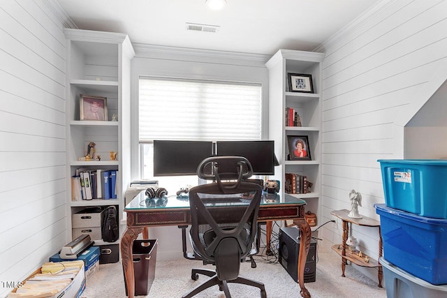 office area featuring built in shelves, light colored carpet, and ornamental molding