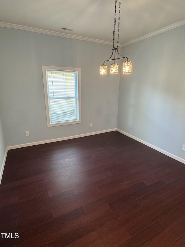 empty room featuring baseboards, visible vents, and dark wood-style flooring