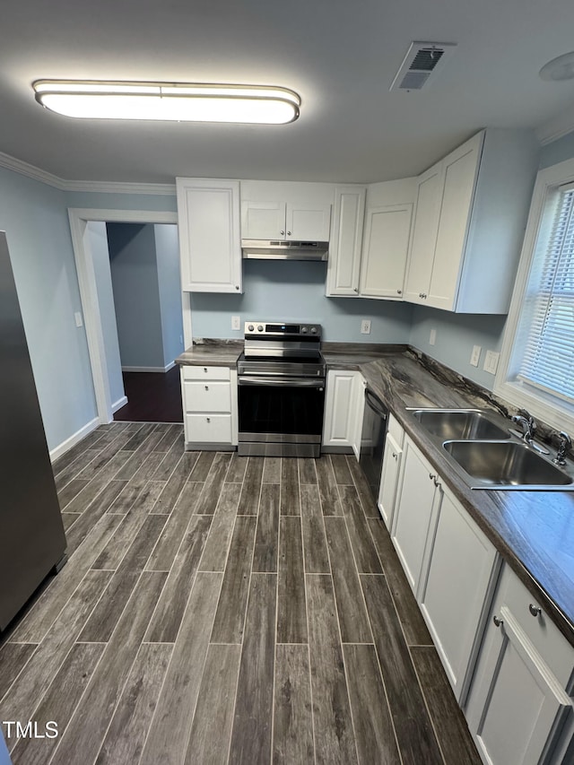 kitchen featuring white cabinets, dark countertops, stainless steel electric stove, under cabinet range hood, and a sink