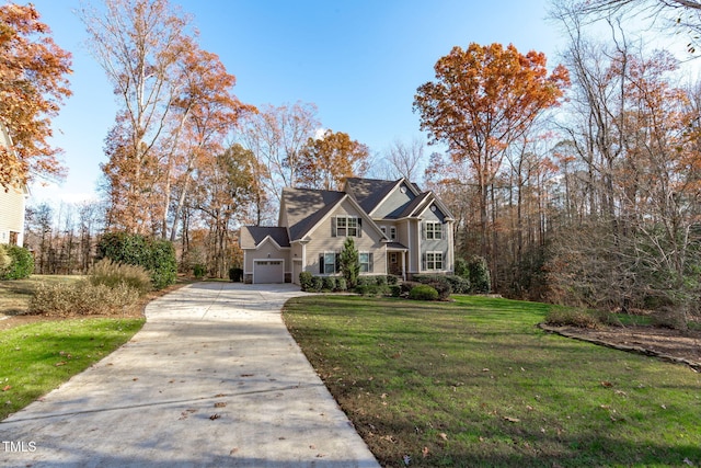 view of front facade featuring a front lawn and a garage