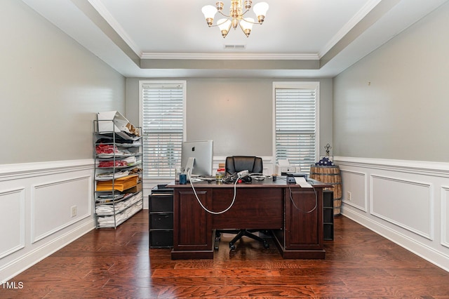 office area with a tray ceiling, crown molding, and dark wood-type flooring