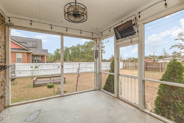 unfurnished sunroom featuring plenty of natural light