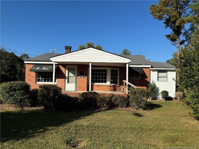 view of front of house with a front lawn and a porch