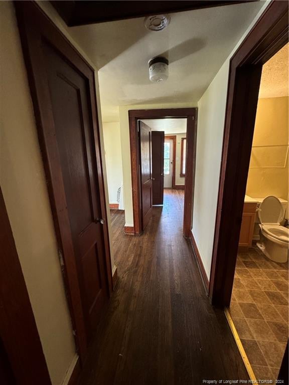 hall with dark hardwood / wood-style floors