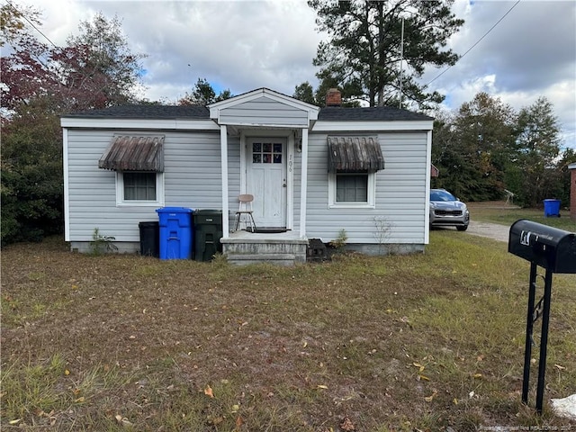 bungalow with a front lawn