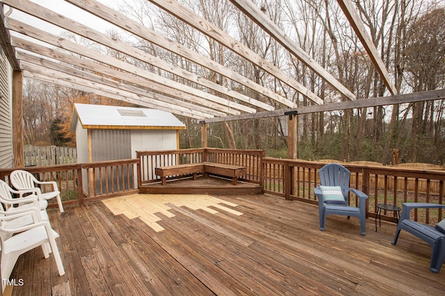 deck with a storage shed and an outdoor structure