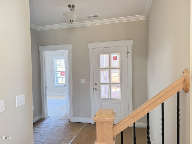 foyer entrance featuring crown molding