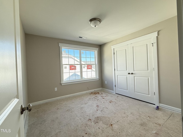 unfurnished bedroom featuring a closet