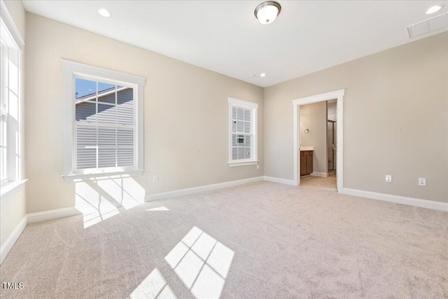 1975 Meadowview Dr, Graham, NC 27253 - empty room with baseboards, recessed lighting, and light carpet