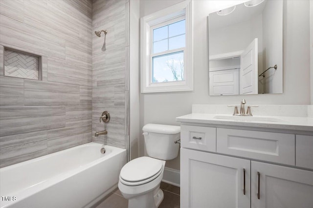 full bathroom with tile patterned floors, vanity, toilet, and tiled shower / bath