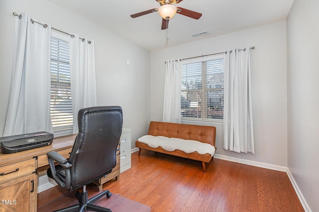 office space with ceiling fan and hardwood / wood-style floors