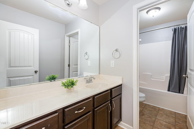 full bathroom featuring vanity, shower / tub combo, and toilet