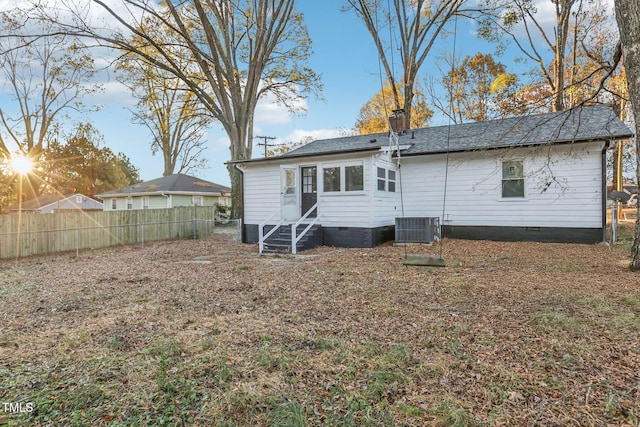 back of property with central AC unit