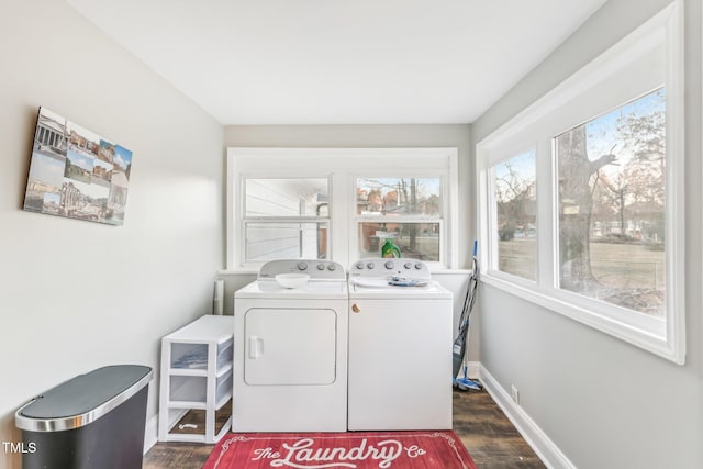 laundry room with dark hardwood / wood-style flooring and washer and dryer