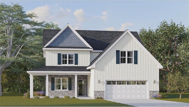 view of front of property with a garage and a front lawn