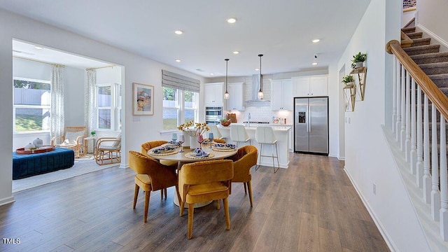 dining room with dark hardwood / wood-style flooring