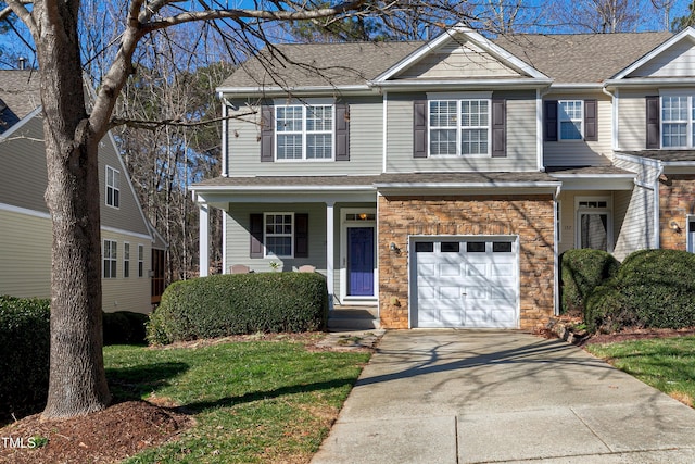 view of front facade with a front lawn and a garage