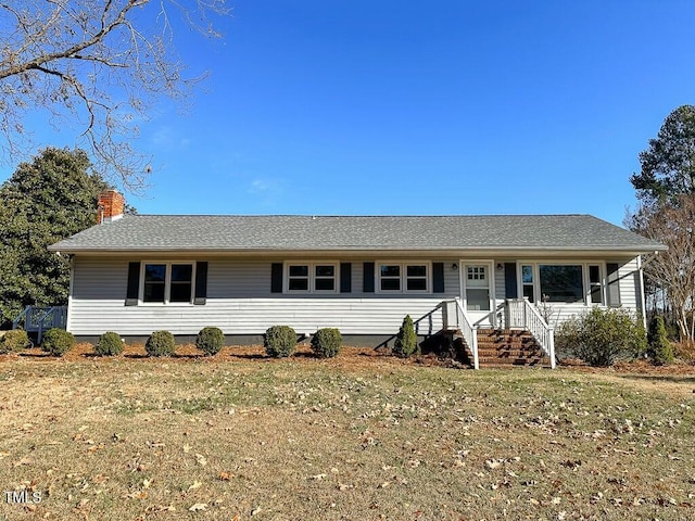 single story home featuring a front yard