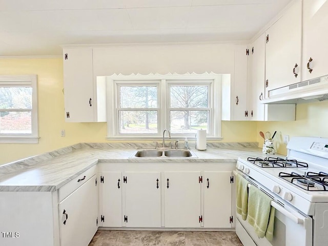 kitchen featuring crown molding, white cabinetry, sink, and white range with gas cooktop