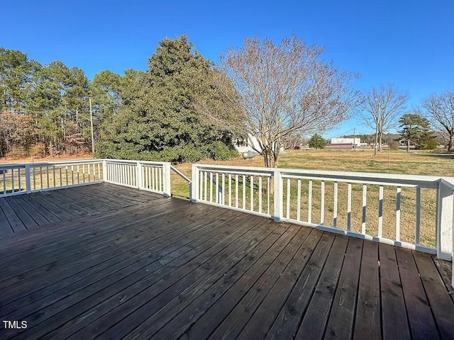 wooden deck with a yard