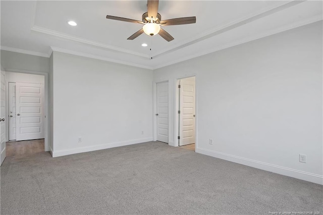 unfurnished bedroom featuring crown molding, carpet floors, recessed lighting, and baseboards