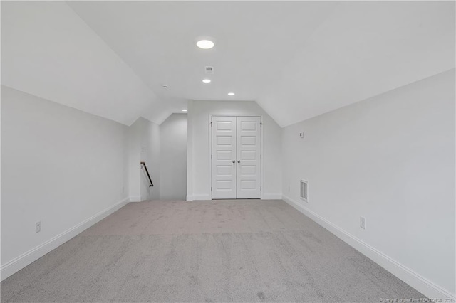 bonus room featuring recessed lighting, visible vents, carpet flooring, vaulted ceiling, and baseboards