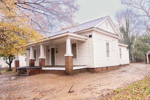 view of property exterior featuring a porch