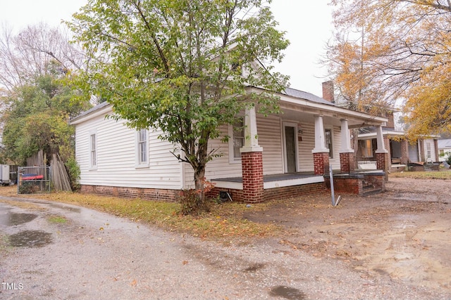 view of home's exterior with covered porch