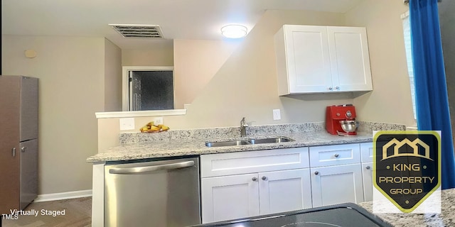 kitchen featuring white cabinetry, stainless steel dishwasher, light stone countertops, and sink