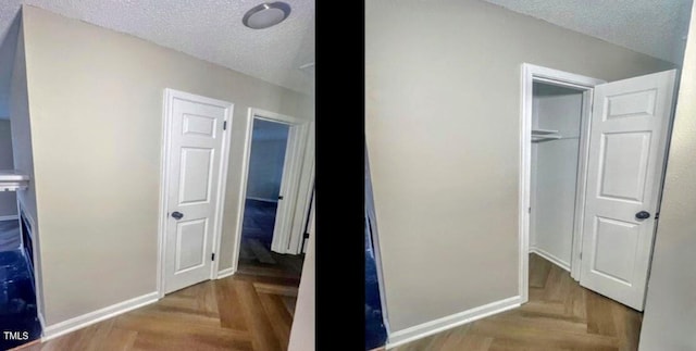 interior space with parquet flooring, a closet, and a textured ceiling