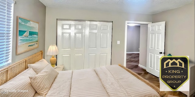 bedroom with a closet and a textured ceiling