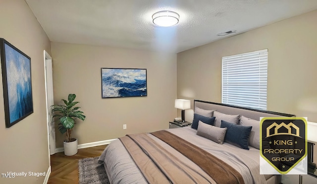 bedroom with a textured ceiling