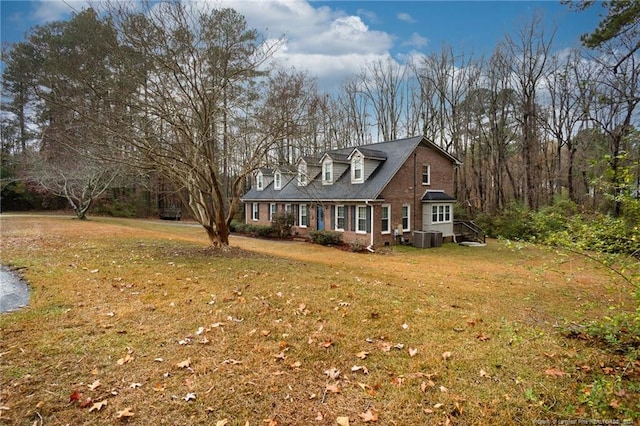 view of property exterior with a lawn and cooling unit