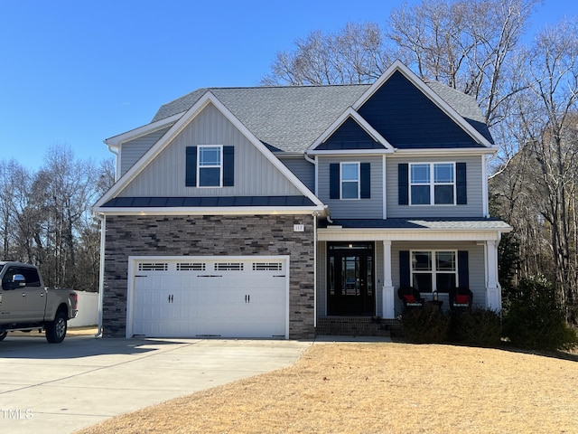 craftsman-style house featuring a porch and a garage