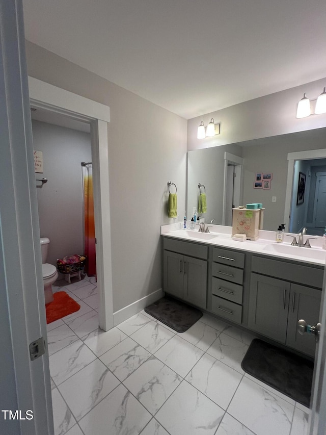 bathroom with vanity and toilet