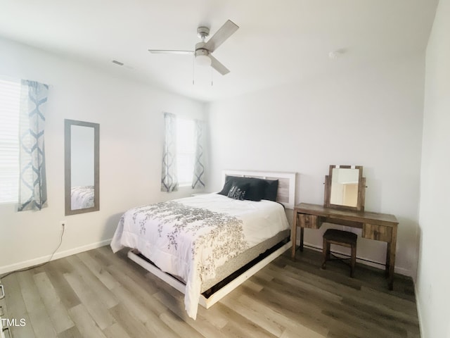 bedroom featuring hardwood / wood-style floors and ceiling fan