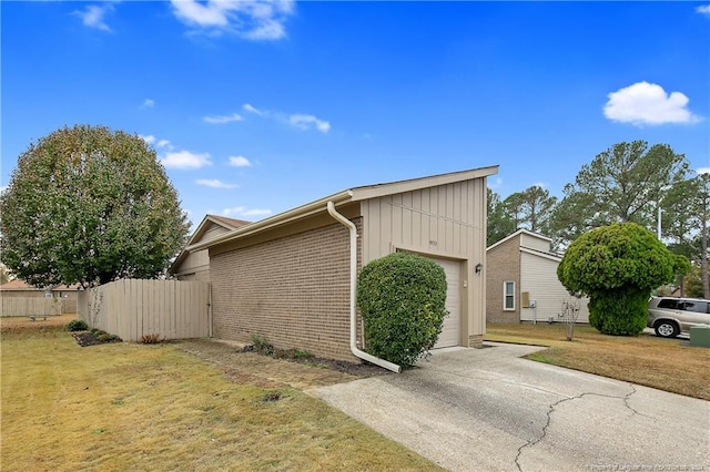 view of home's exterior featuring a yard and a garage