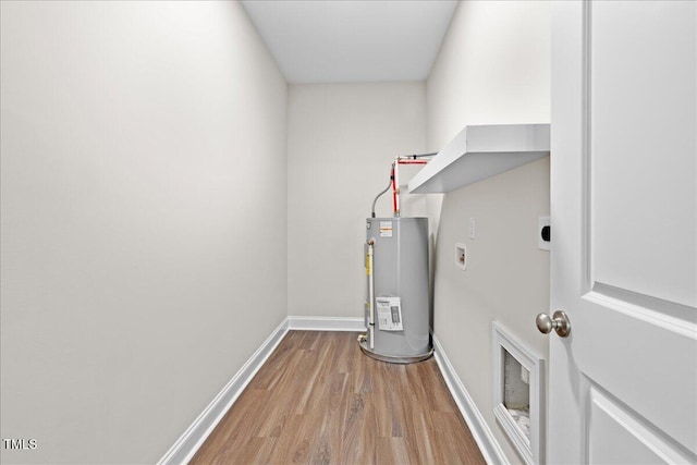 utility room featuring gas water heater