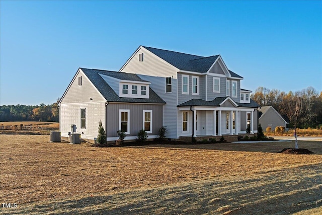 view of front of house with central AC unit and a porch