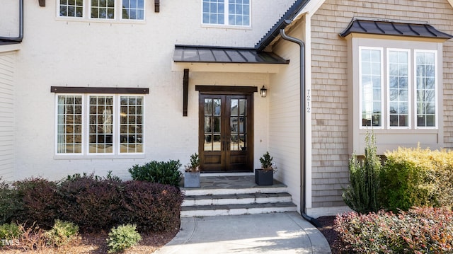 entrance to property featuring french doors