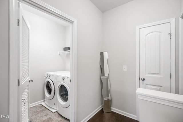 washroom with dark hardwood / wood-style flooring and separate washer and dryer