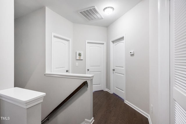 hall with dark hardwood / wood-style flooring