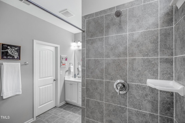 bathroom featuring tile patterned flooring and vanity