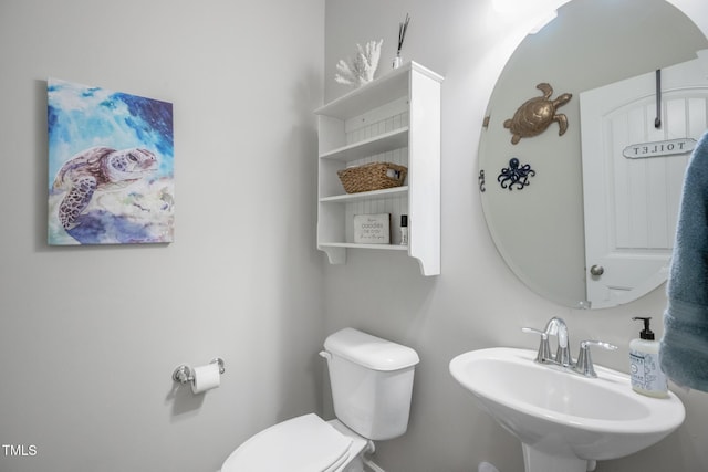 bathroom with sink and toilet