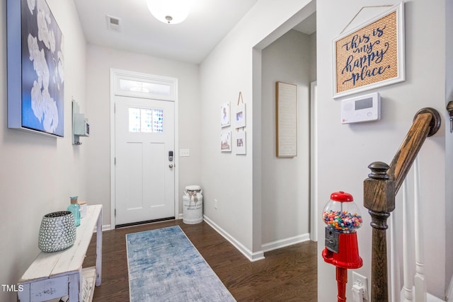 foyer entrance with dark wood-type flooring